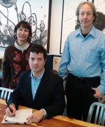 Blumenfeld signs a stipulated order to protect San Francisco Bay. Also pictured are Michelle Moustakas, EPA engineer, and Hugh Barroll, EPA attorney.