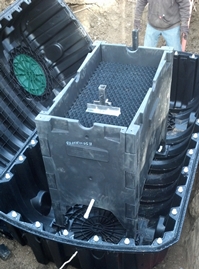  A compact wastewater treatment system is installed within a two-piece tank. This greatly simplifies part assembly, visibility, and open access (no confined space). Once the tank construction is competed, maintenance can be performed via the access ports. (Photo by Infiltrator Water Technologies)