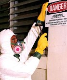 Workers have to wear protective gear when removing asbestos