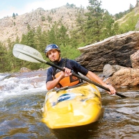 A kayaker negotiates the Cache la Poudre River near Fort Collins, Colo. (Matt Inden/Miles photo downloaded from the Colorado Tourism Office website)