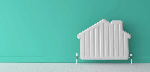 a radiator in the shape of a house against a teal background