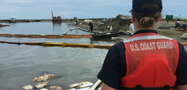 U.S. Coast Guard Petty Officer 3rd Class Lyndsey Slabe eyes cleanup efforts in Bay Long, La., on  Sept. 10, 2016. A unified command of the Coast Guard, Louisiana Oil Spill Coordinator’s Office, and ECM Maritime Services was established Sept. 6 to the spill. (Photo by Petty Officer 3rd Class Brandon Giles)