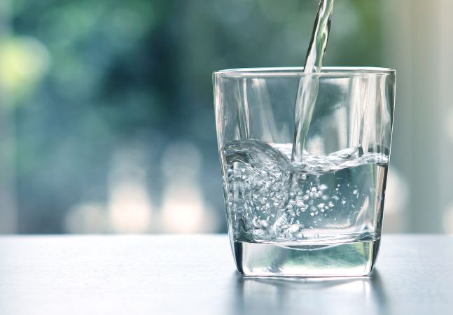 Water Glass Being Filled