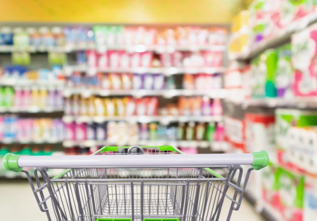 Shopping Cart in Grocery Aisle