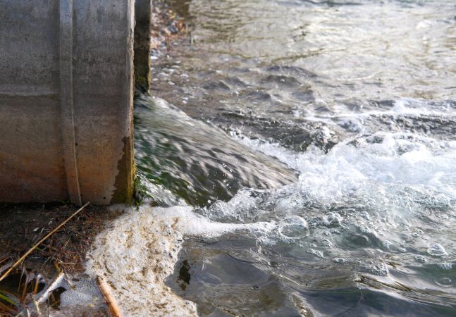 Treated water flowing back into river through pipe