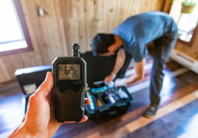 Professionals conducting indoor air quality test