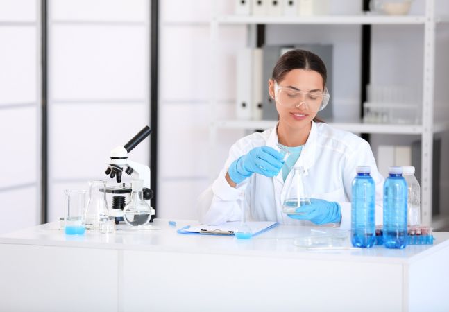 Scientist testing water in a lab