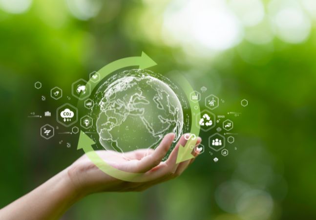 Hand holding a graphic of Earth as a sustainability concept